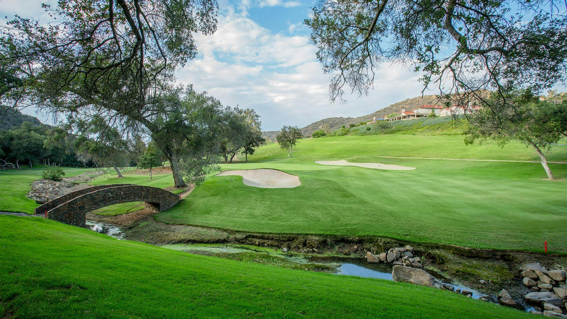 Golf course with creek and bridge